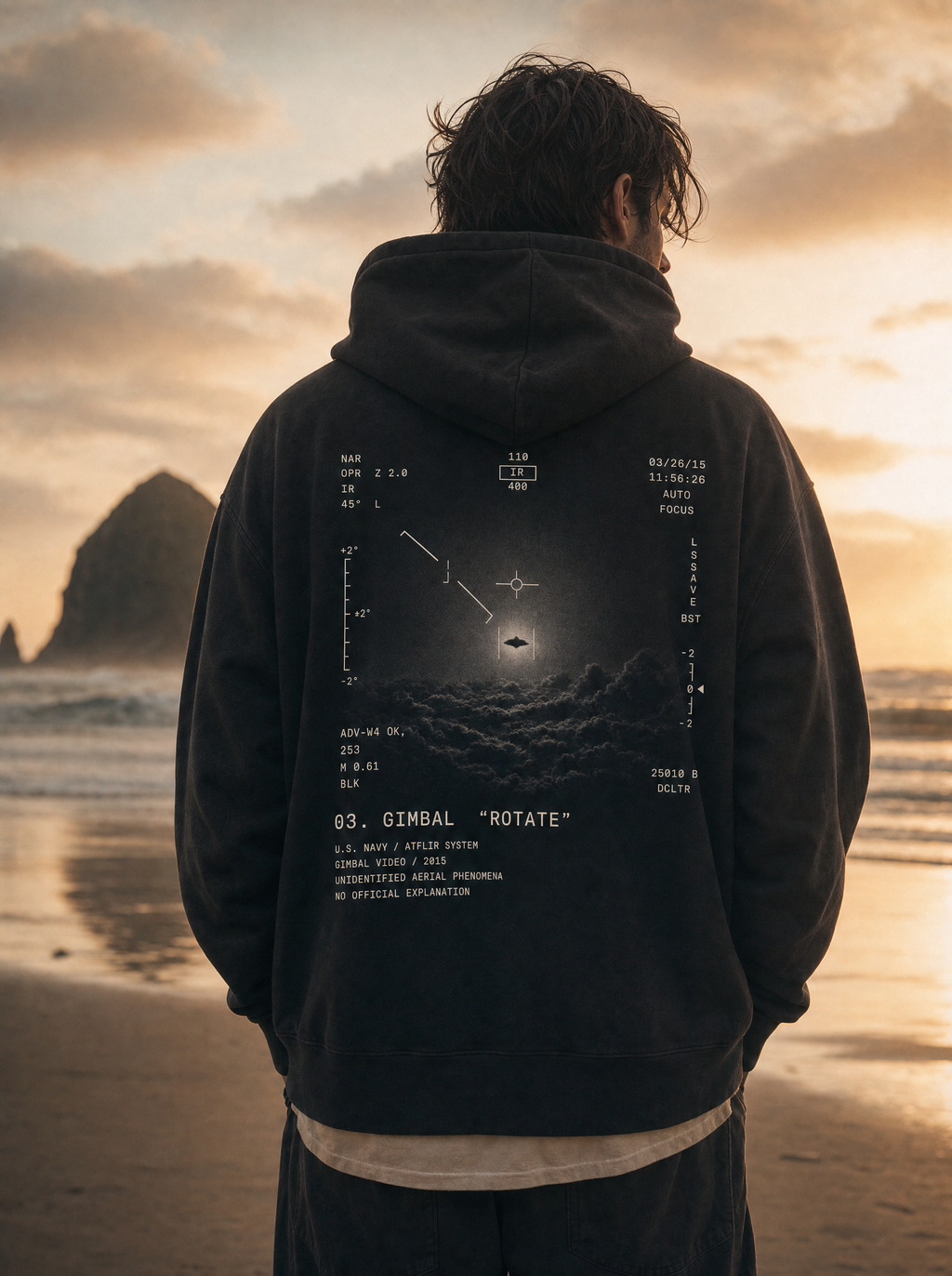 Gimbal UAP Hoodie - model on Cannon Beach at sunset, ATFLIR back print, cinematic