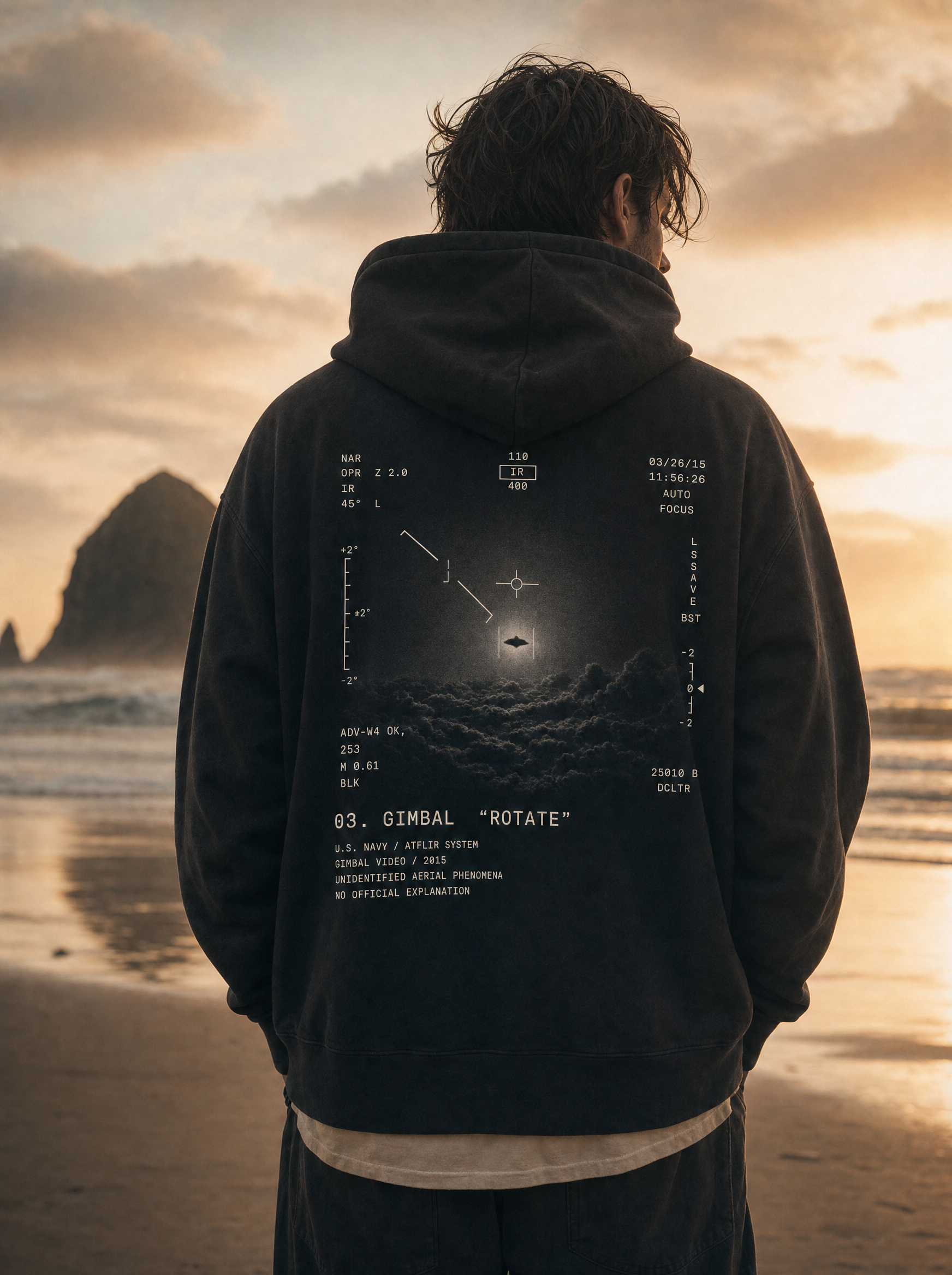 Gimbal UAP Hoodie - model on Cannon Beach at sunset, ATFLIR back print, cinematic
