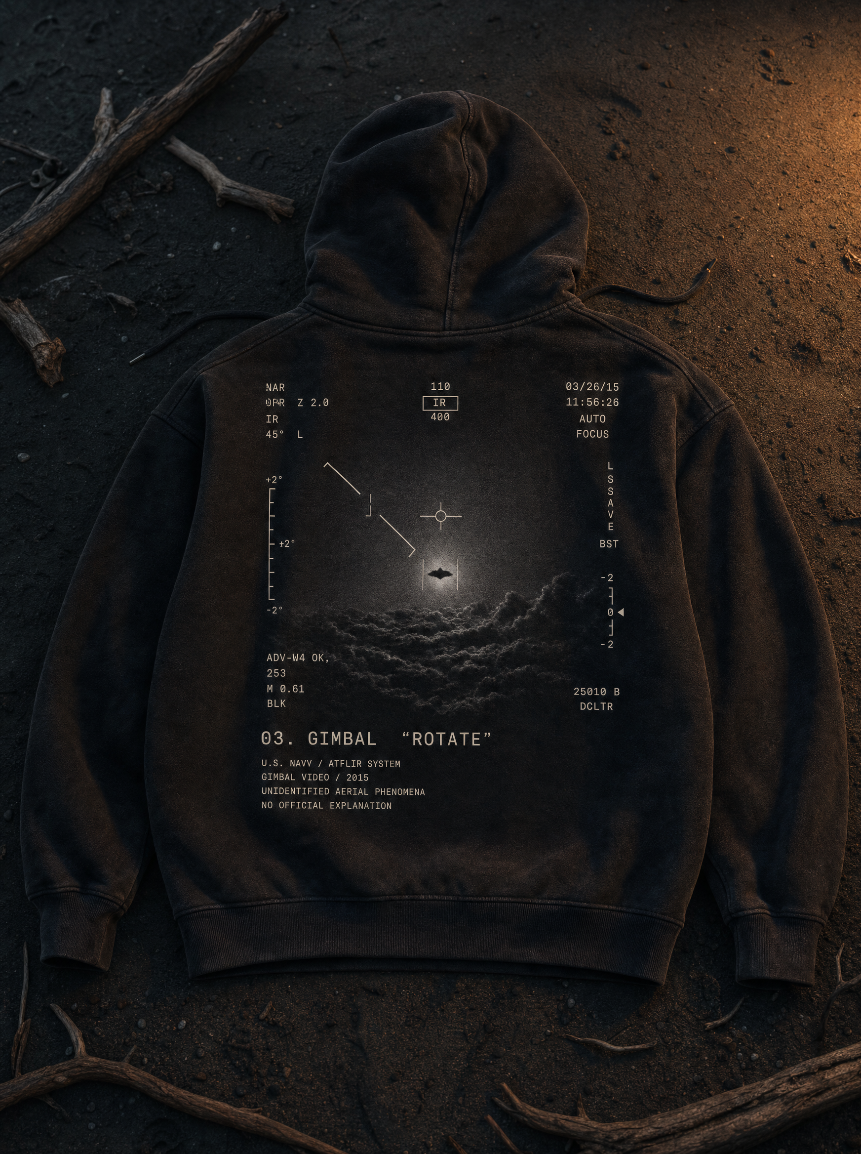 Gimbal UAP Hoodie - flat lay on beach sand at twilight