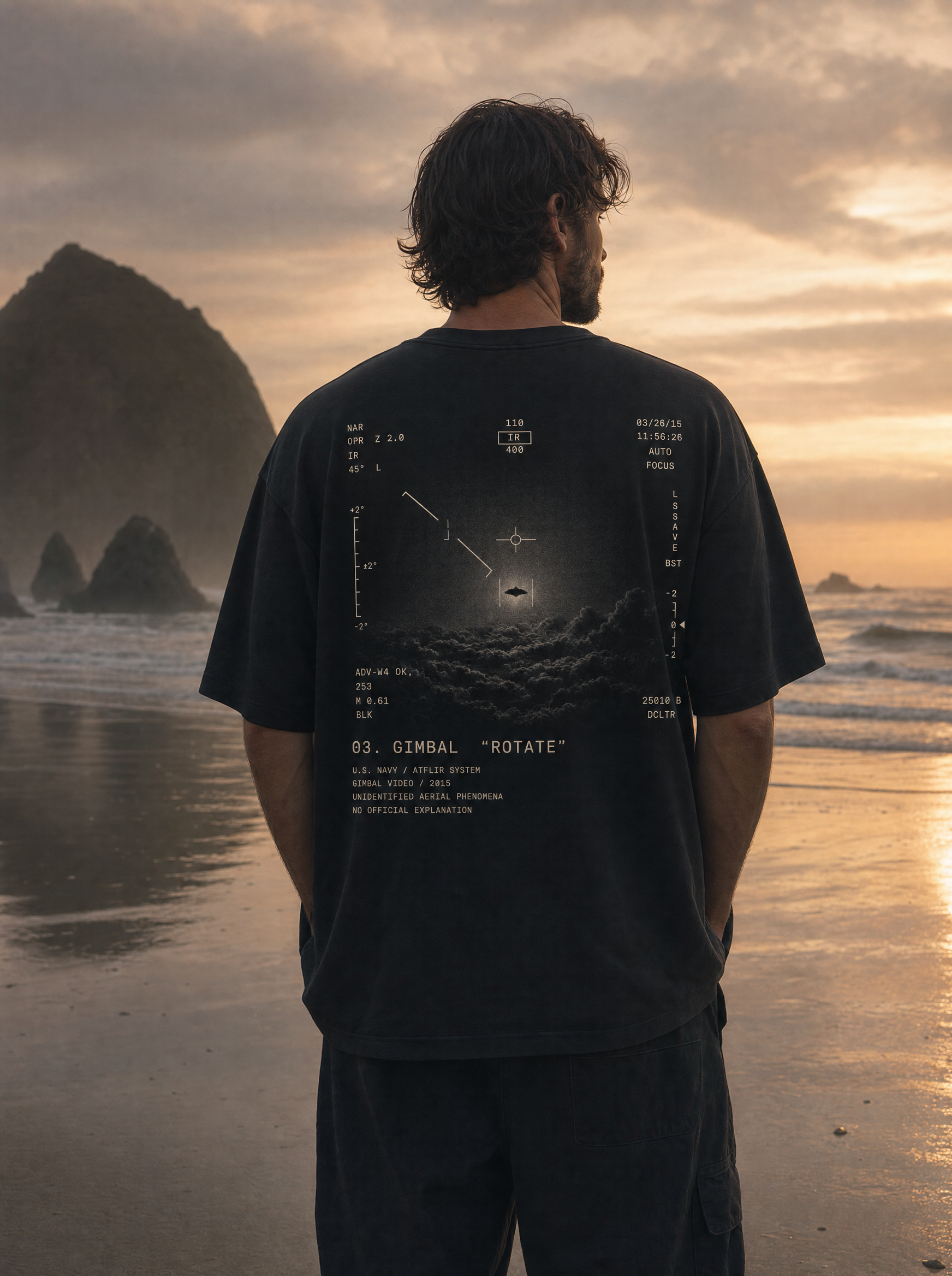 Gimbal UAP Tee - model on Cannon Beach at sunset, ATFLIR back print, cinematic